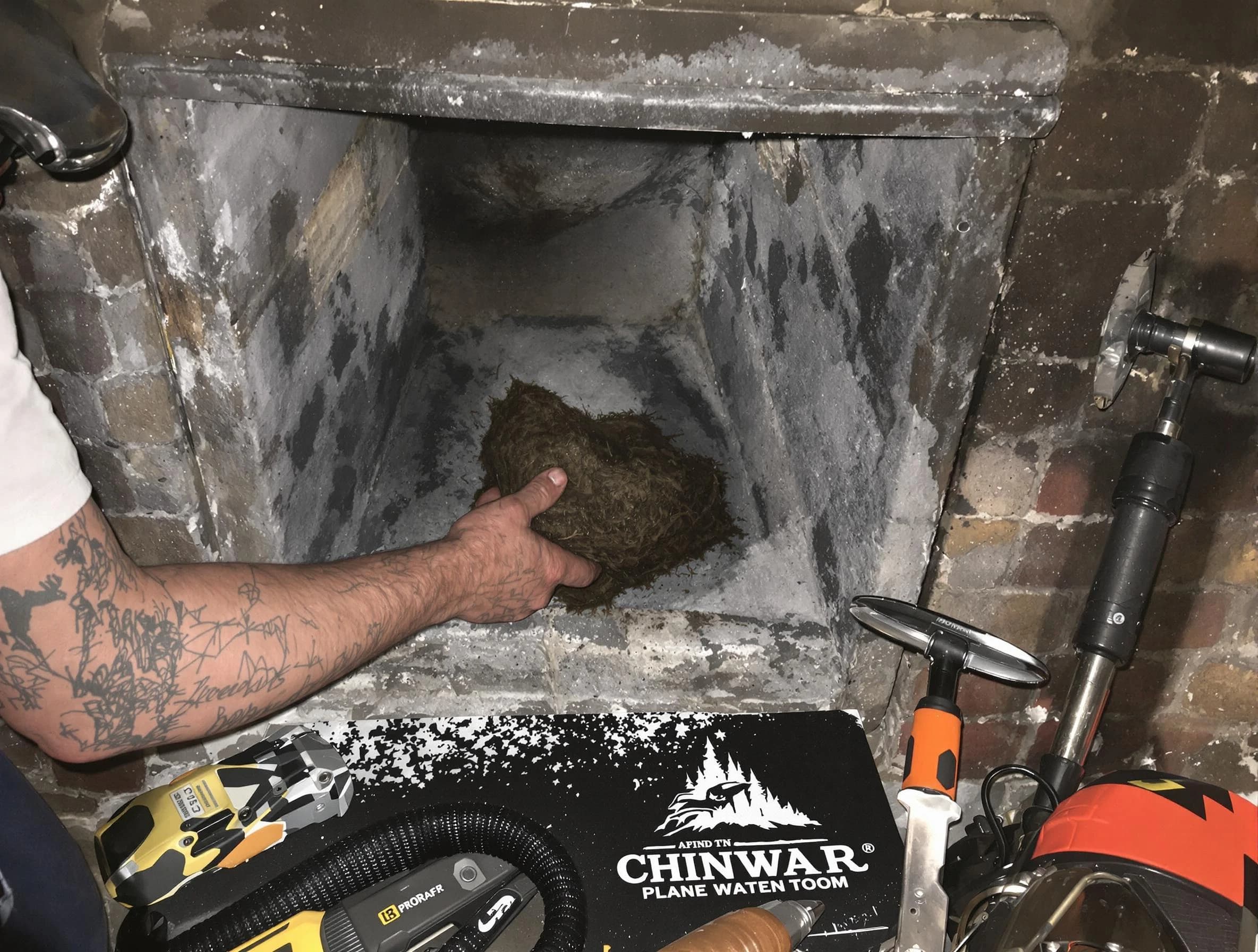 Portland Chimney Sweep safely removing debris and screening chimney in Portland, TN
